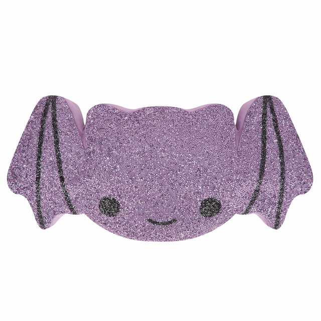 Bat-shaped pillow in shimmering lavender with glittery texture black facial features and pink edges.