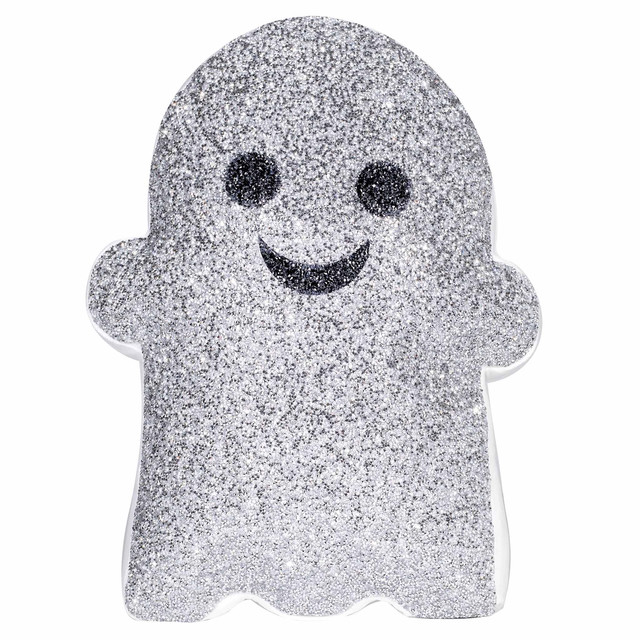 Silver glitter ghost-shaped pillow with black eyes and a smiling mouth featuring a plush texture and a white border.