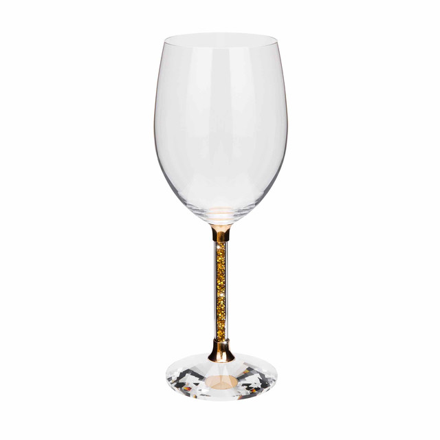 Clear crystal wine glass with a gold stem featuring yellow rhinestones and a faceted clear base.