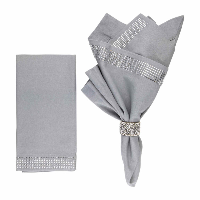 Gray linen-cotton napkins with crystal rhinestone bands one folded and one flat showcasing a smooth texture and elegant embellishments.