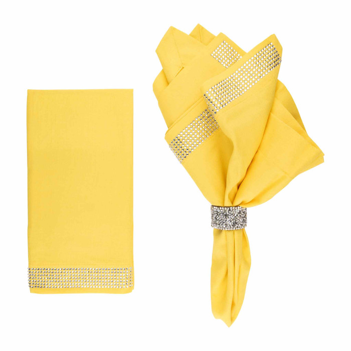 Yellow linen and cotton napkins with crystal rhinestone bands one neatly folded and one flat featuring a smooth texture.