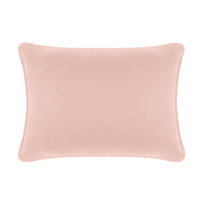 Blush velvet rectangular pillow with a smooth texture and rounded edges.