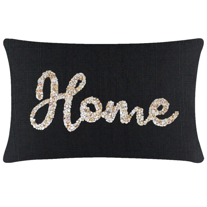 Black rectangular pillow with textured fabric featuring a seashell design spelling "Home" in white and beige tones.