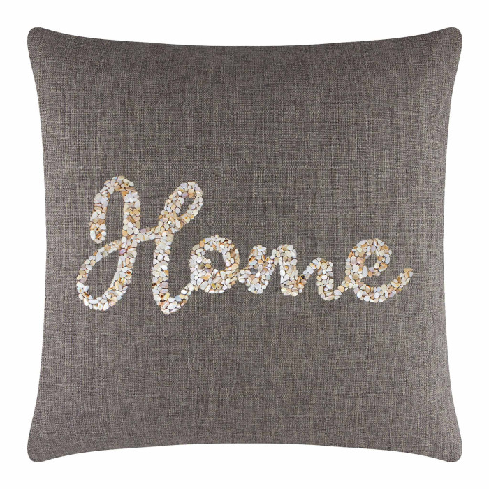 Square brown pillow with a textured fabric featuring a seashell design spelling "Home" in cream and beige tones.