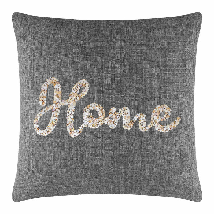 Gray fabric pillow with seashell design spelling "Home" in cream beige and light brown hues featuring a textured surface.