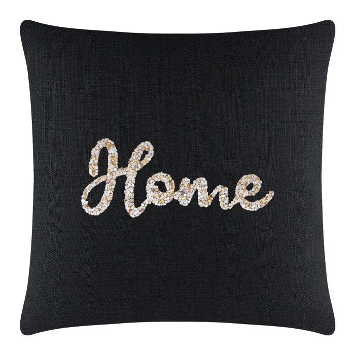Black textured pillow with a seashell "Home" design in iridescent white and gold embellishments.