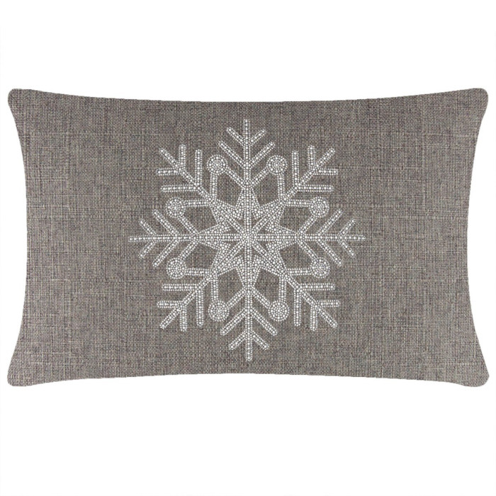 Brown rectangular pillow with a textured surface featuring a large rhinestone snowflake design in white and silver.