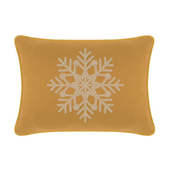 Gold velvet pillow with a rhinestone snowflake design rectangular shape smooth texture and contrasting edges.