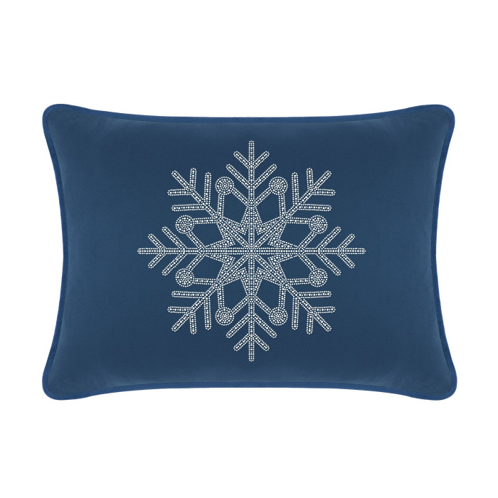 Navy velvet pillow featuring a large rhinestone snowflake design on the front with a smooth texture and piped edges.