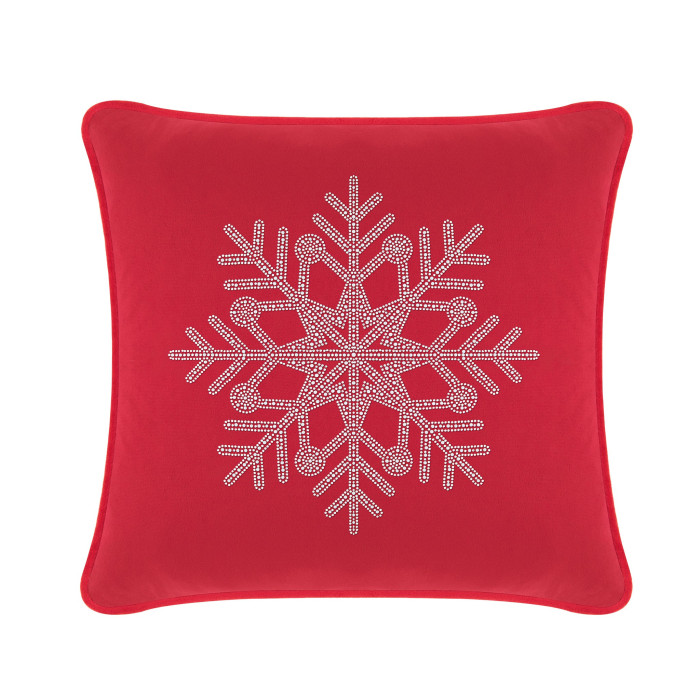 Red velvet pillow featuring a rhinestone snowflake design in the center with a smooth plush texture.