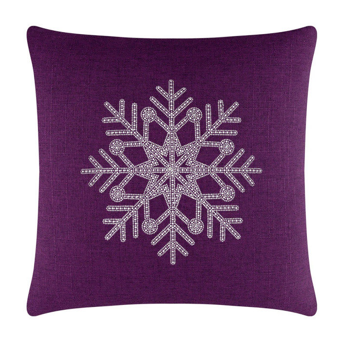 Purple linen pillow featuring a rhinestone snowflake design in the center.