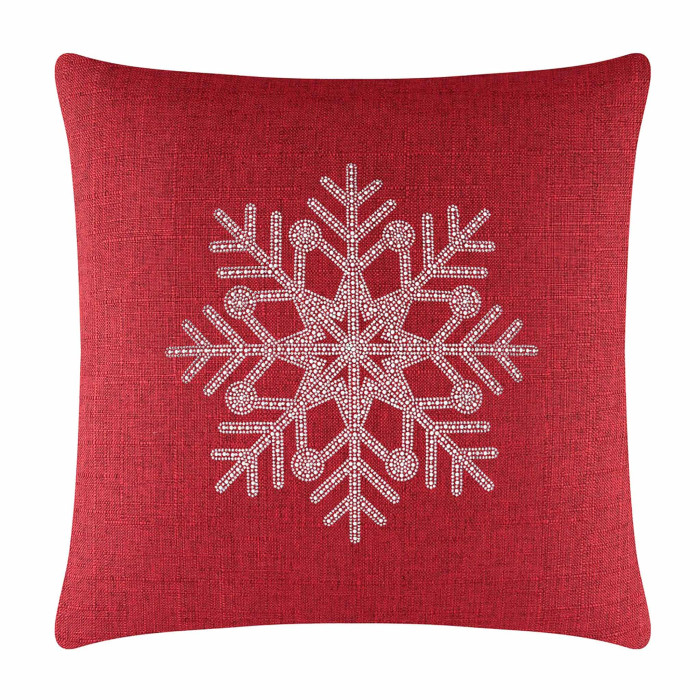 Red textured pillow featuring a rhinestone snowflake design in the center with intricate snowflake patterns.