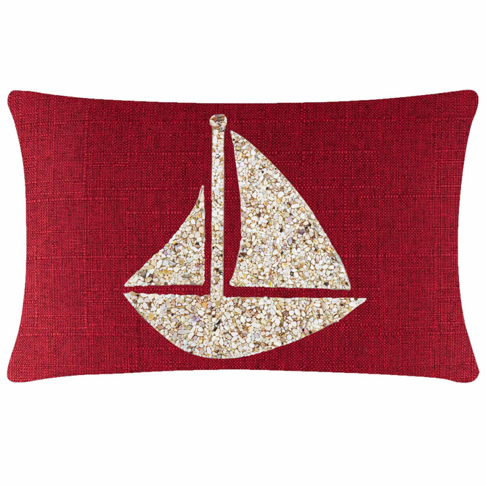 Red textured pillow featuring a seashell sailboat design in beige and cream tones.