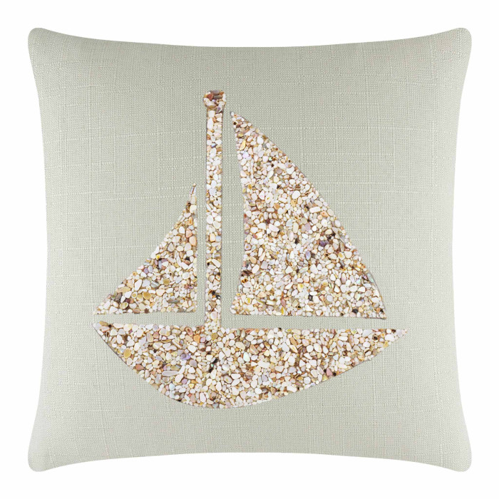 Square linen pillow in soft green with a textured surface featuring a seashell sailboat design in beige and cream tones.
