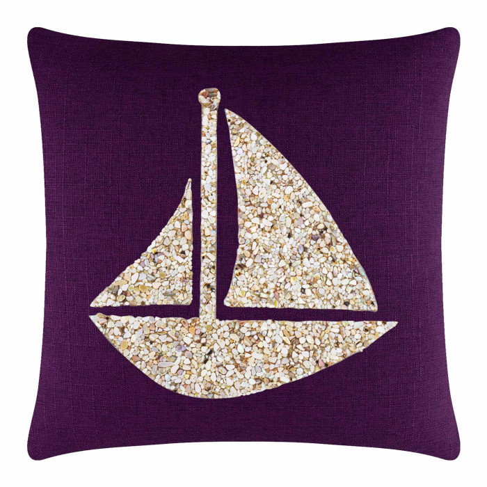 Purple textured pillow featuring a seashell sailboat design in beige and cream tones.