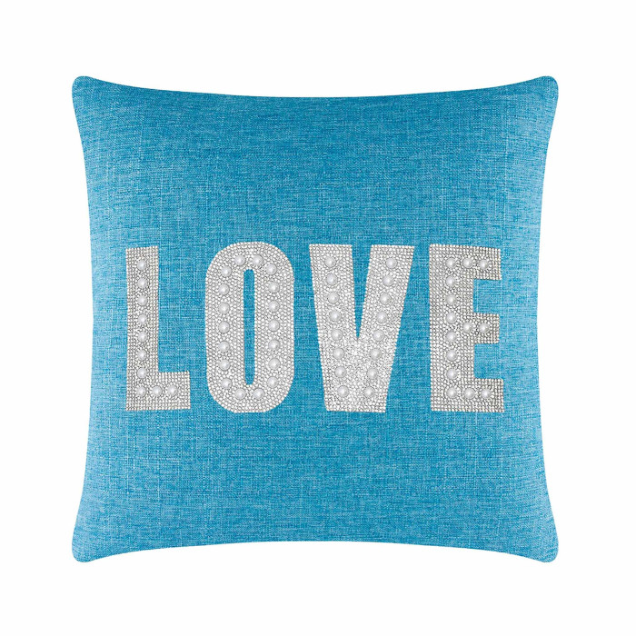 Aqua square pillow with "LOVE" in rhinestones and faux pearls on a textured woven surface.