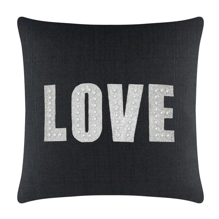 Black woven pillow featuring the word "LOVE" in rhinestones and faux pearls with a plush texture and square shape.