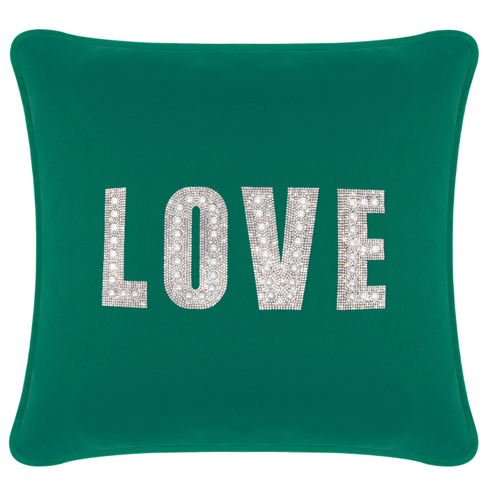 Emerald green velvet pillow with rhinestone and faux pearl embellishments spelling "LOVE" in large letters.