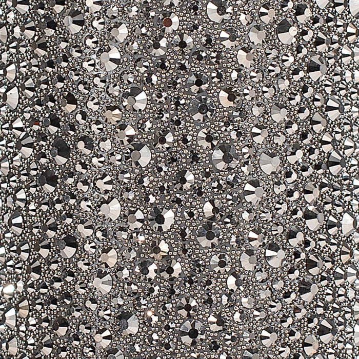 Charcoal fabric with an array of silver and clear rhinestones in various sizes and shapes densely arranged for sparkle.