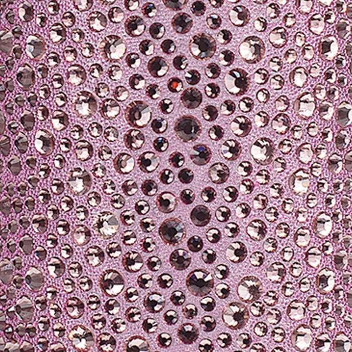 Lavender fabric with various sizes of clear and dark purple rhinestones arranged in a decorative pattern.