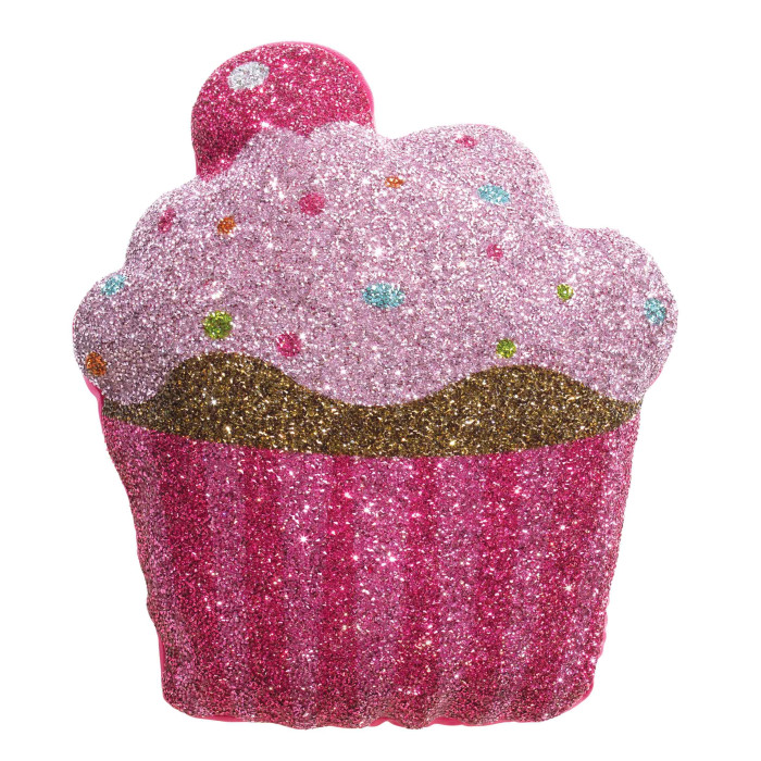Pink cupcake-shaped pillow with glitter a golden frosting band and colorful sprinkle embellishments on a soft texture.