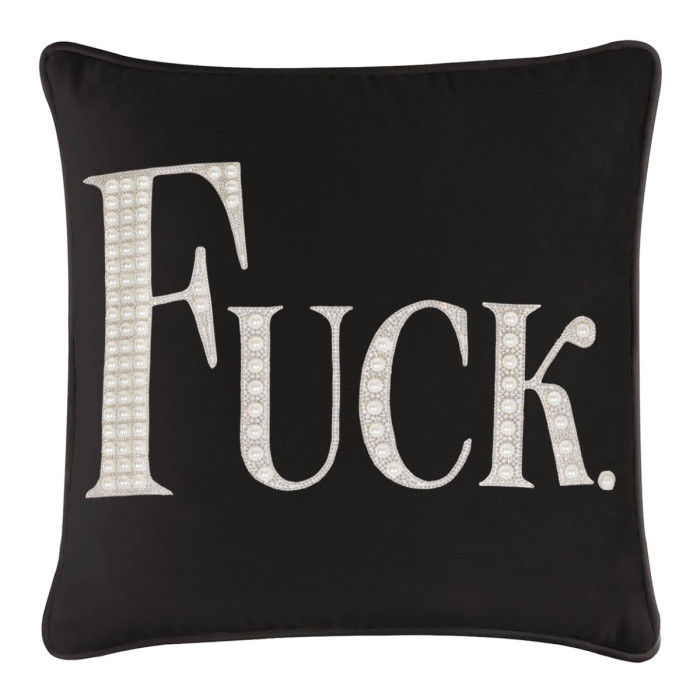 Black velvet pillow featuring a large expletive in faux pearls and rhinestones with a smooth texture and piped edges.