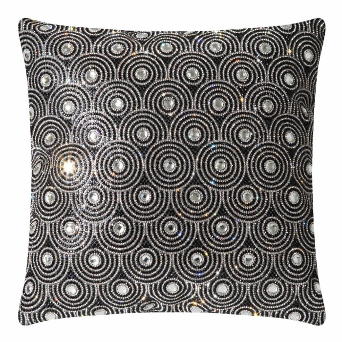 Black velvet pillow with circular glass rhinestone embellishments in an orbital pattern featuring a soft texture and plush shape.
