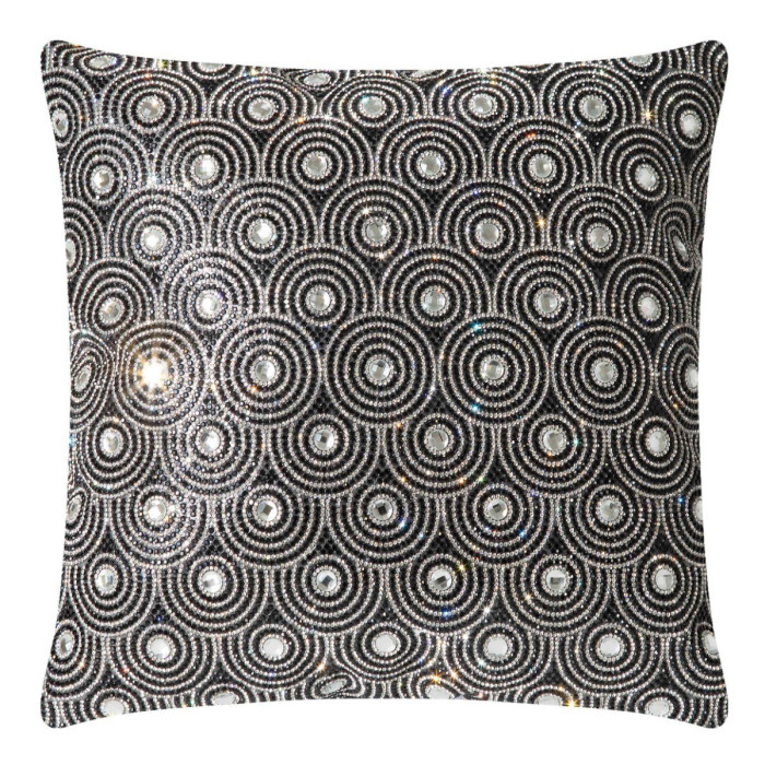 Black velvet pillow with circular glass rhinestone embellishments in an orbital pattern featuring a textured surface and plush shape.