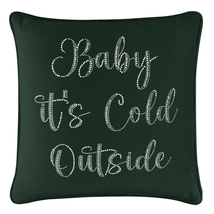 Emerald velvet pillow with glass rhinestones spelling "Baby it's Cold Outside" in a cursive font on a dark green background.