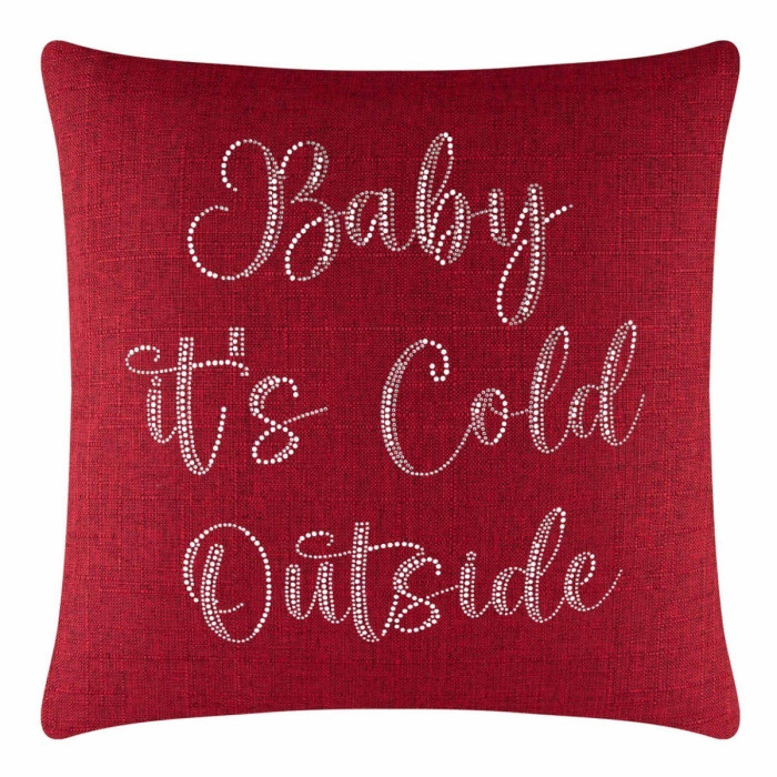 Red square pillow with a textured fabric featuring white glass rhinestones arranged in a cursive font design.
