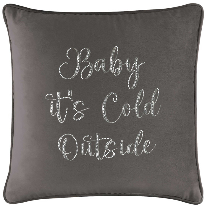 Charcoal velvet pillow with glass rhinestones spelling "Baby it's Cold Outside" in cursive font and a piped edge.