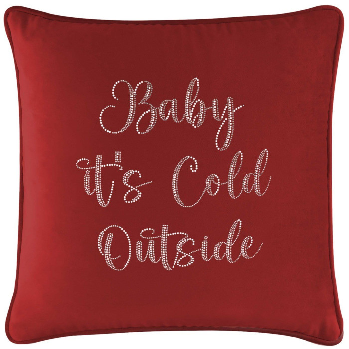 Red velvet pillow featuring glass rhinestones spelling "Baby it's Cold Outside" in a cursive font.