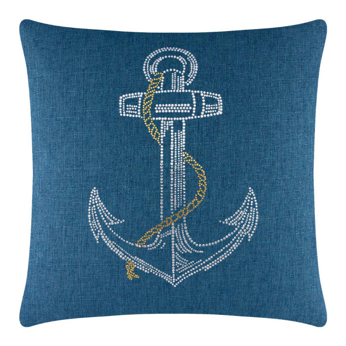 Square blue pillow featuring a rhinestone anchor design with a gold chain embellishment on a textured fabric surface.