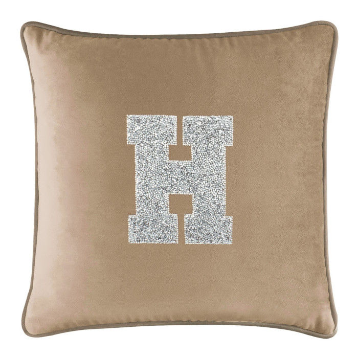 Champagne velvet pillow with a silver rhinestone "H" monogram square shape soft texture and contrasting piped edge.