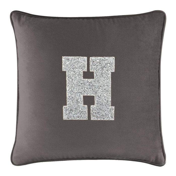 Charcoal velvet pillow with a large rhinestone-embellished letter "H" in the center and a contrasting piped edge.
