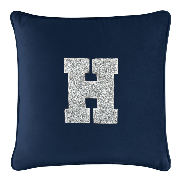 Navy velvet pillow featuring a large silver rhinestone monogram "H" in the center with piped edges.