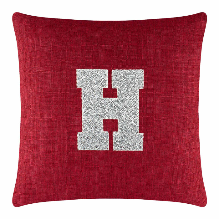 Red textured pillow featuring a large silver rhinestone monogram letter "H" in the center.