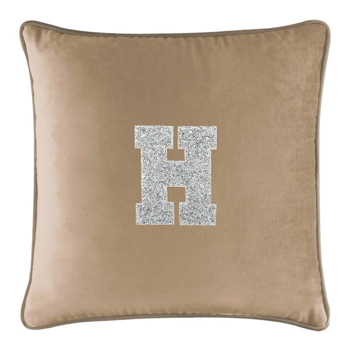 Champagne velvet pillow with a large rhinestone-embellished letter "H" in silver on the front featuring a soft plush texture.