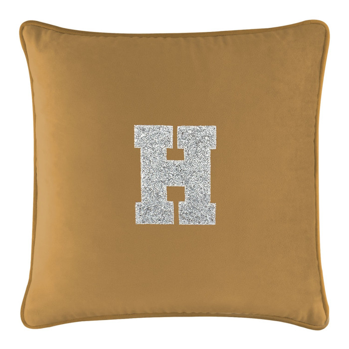 Gold velvet pillow with a silver rhinestone monogram letter "H" in the center soft texture and square shape.