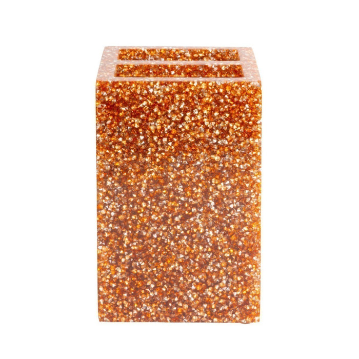 A rectangular toothbrush holder with a topaz orange textured surface encrusted with sparkling rhinestones.