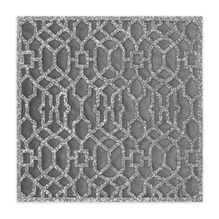 Silver velvet placemat with a laser-cut lattice design and rhinestone embellishments throughout the pattern.