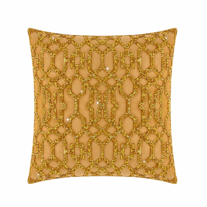 Square pillow in gold velvet with laser-cut rhinestone lattice pattern plush texture and smooth edges.