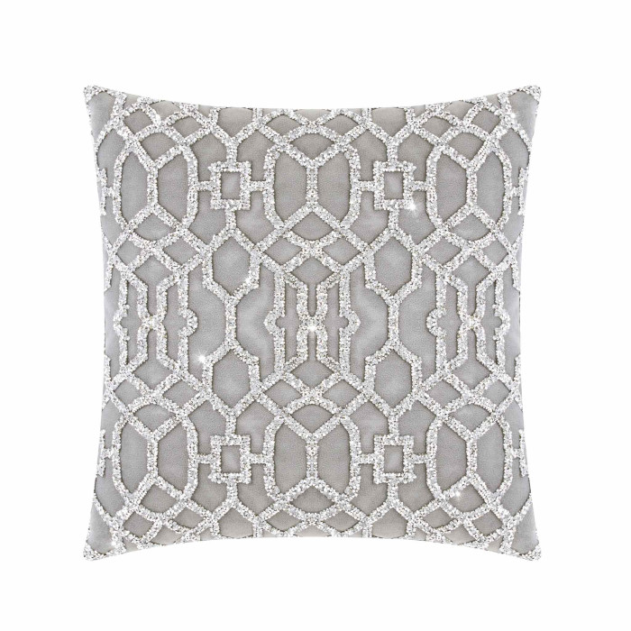 Silver pillow with a lattice pattern of laser-cut rhinestones on a plush velvet background featuring shades of grey.