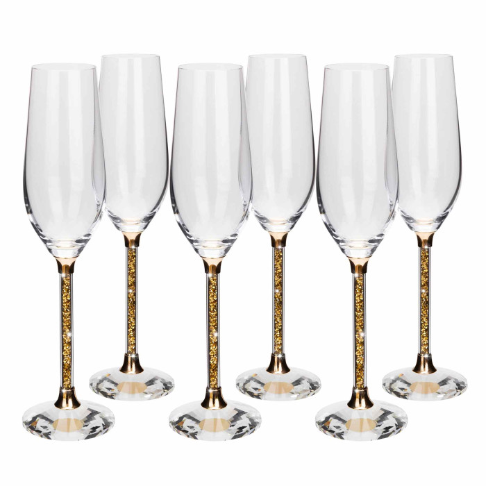 Clear crystal toasting flute with a gold-tone stem featuring a sparkling gold embellishment and a round base.