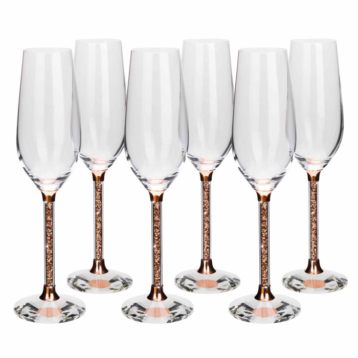 Clear crystal toasting flute with a rose gold stem filled with small rose gold beads and a faceted clear glass base.