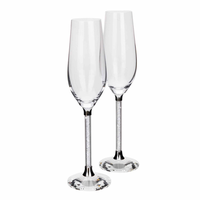 Clear crystal toasting flute with a textured silver stem and a round faceted base measures 10 inches tall and 3 inches wide.