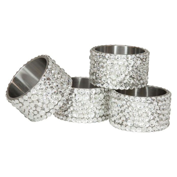 Four stainless steel napkin rings adorned with clear glass rhinestones featuring a round shape and smooth texture.