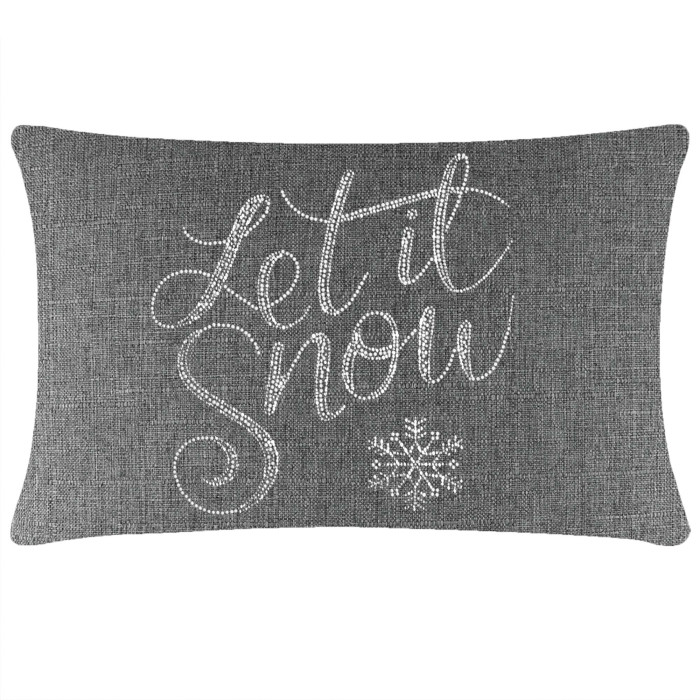 Gray rectangular pillow with "Let it Snow" in glass rhinestones and a snowflake design on a textured fabric surface.
