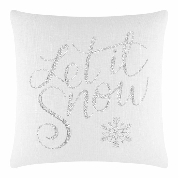 White square pillow featuring "Let it Snow" in glass rhinestones with a snowflake design on a textured fabric surface.