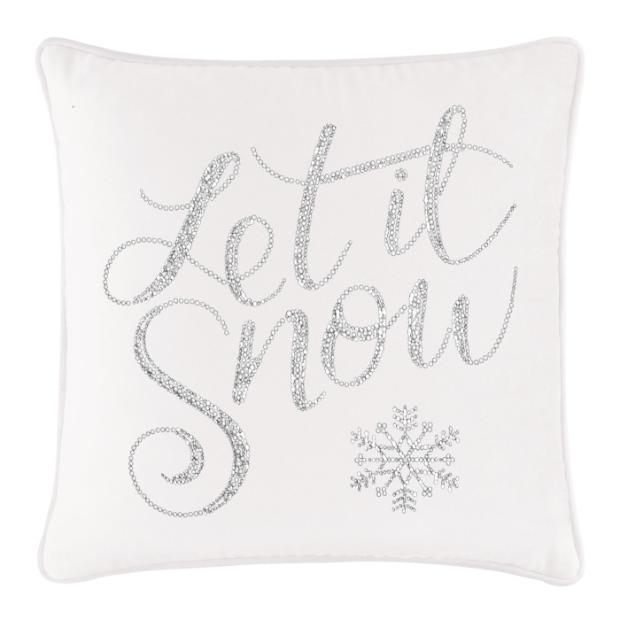White velvet pillow featuring silver rhinestone text "Let it Snow" and a snowflake design.